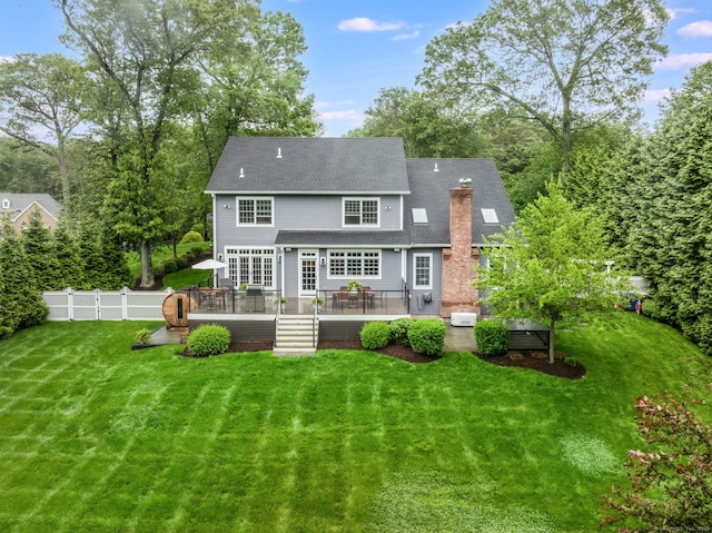 975 Flintlock Rd, Fairfield, CT 06890 - back of house featuring a chimney, a wooden deck, and a shingled roof