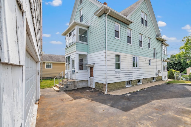 174 Franklin Ave, Stratford, CT 06614 - view of side of home with a chimney