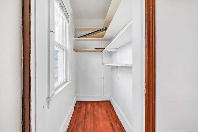 174 Franklin Ave, Stratford, CT 06614 - walk in closet with dark wood finished floors