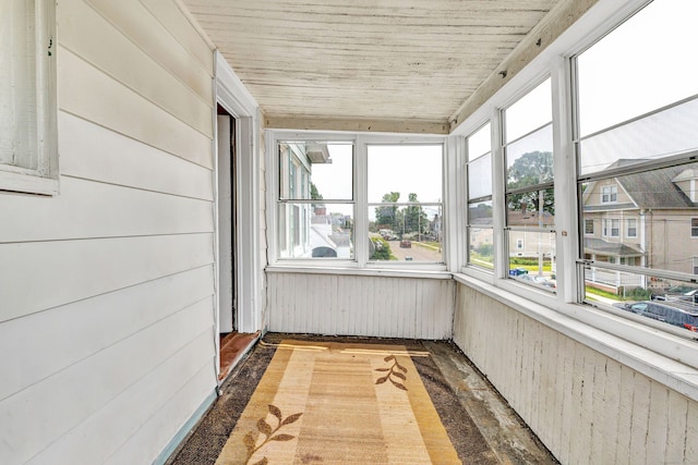 174 Franklin Ave, Stratford, CT 06614 - unfurnished sunroom featuring healthy amount of natural light, wood finished floors, wooden walls, and wooden ceiling