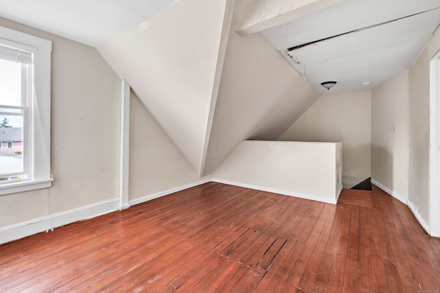 174 Franklin Ave, Stratford, CT 06614 - additional living space with vaulted ceiling, hardwood / wood-style floors, and baseboards