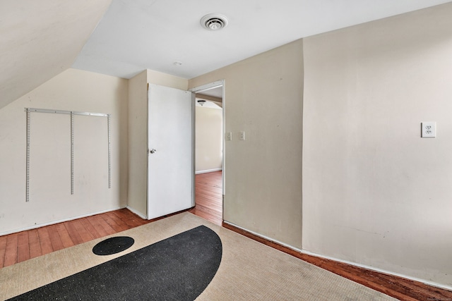174 Franklin Ave, Stratford, CT 06614 - additional living space featuring wood-type flooring, baseboards, and vaulted ceiling