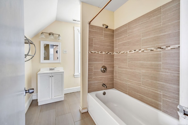 174 Franklin Ave, Stratford, CT 06614 - full bathroom featuring bathing tub / shower combination, vanity, baseboards, and lofted ceiling