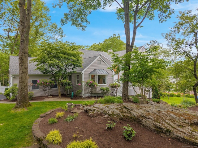 14 The Mews, Westport, CT 06880 - view of front of house featuring roof with shingles and a front yard