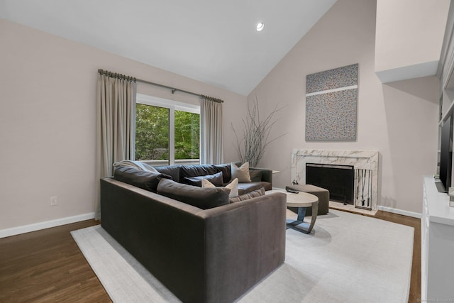 14 The Mews, Westport, CT 06880 - living room with high vaulted ceiling, dark wood-style floors, baseboards, a fireplace, and recessed lighting