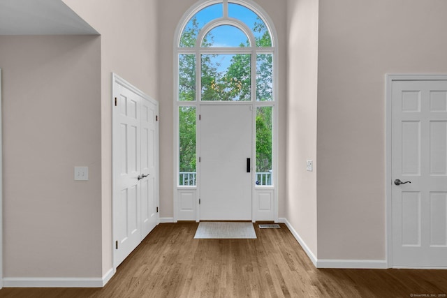 14 The Mews, Westport, CT 06880 - foyer entrance with wood finished floors, baseboards, and a towering ceiling