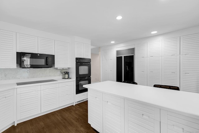 14 The Mews, Westport, CT 06880 - kitchen with black appliances, light countertops, recessed lighting, white cabinetry, and dark wood-type flooring