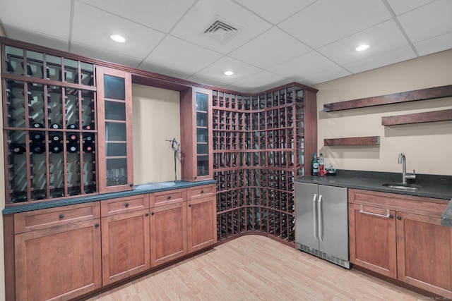 14 The Mews, Westport, CT 06880 - wine area featuring light wood finished floors, wet bar, and a drop ceiling