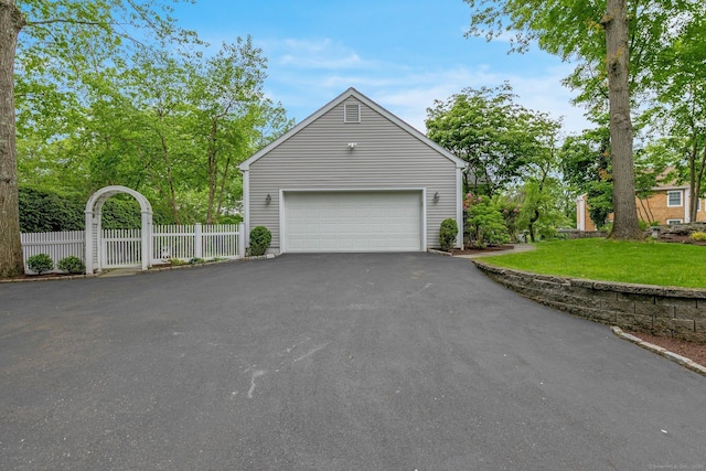 14 The Mews, Westport, CT 06880 - view of side of home featuring a garage and asphalt driveway