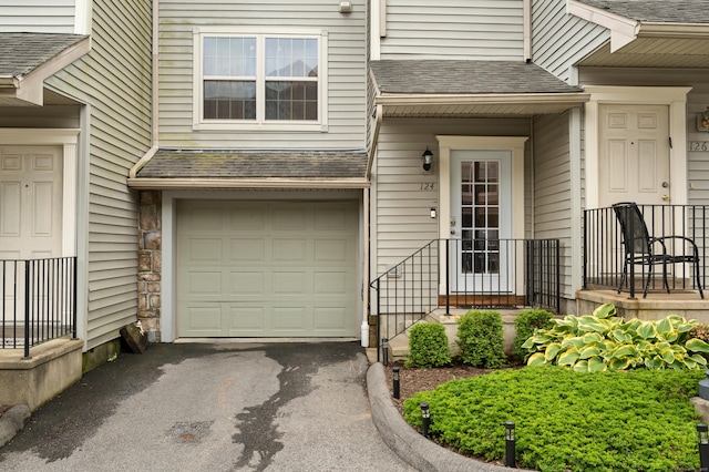 19 Hawthorne Dr Unit 124, New London, CT 06320 - view of exterior entry with an attached garage and asphalt driveway
