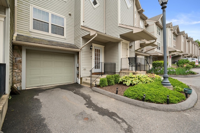 19 Hawthorne Dr Unit 124, New London, CT 06320 - view of front of home with a garage and asphalt driveway