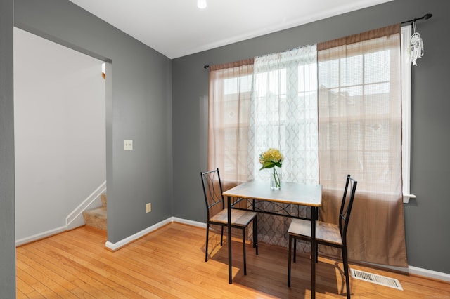 19 Hawthorne Dr Unit 124, New London, CT 06320 - dining room featuring light wood finished floors, baseboards, and stairs