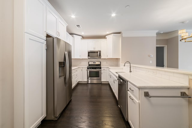 802 Center Meadow Ln Unit 802, Danbury, CT 06810 - kitchen featuring appliances with stainless steel finishes, a peninsula, tasteful backsplash, ornamental molding, and white cabinets