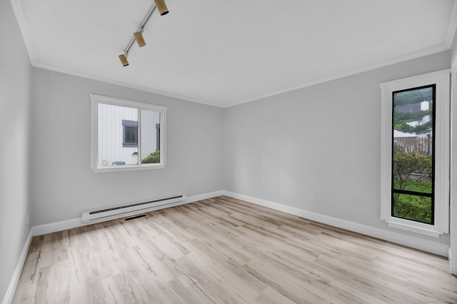 170 Heritage Vlg Unit B, Southbury, CT 06488 - empty room with a baseboard heating unit, ornamental molding, healthy amount of natural light, and light wood-style floors