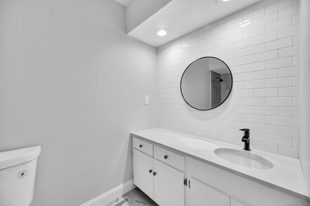 170 Heritage Vlg Unit B, Southbury, CT 06488 - bathroom with vanity, baseboards, toilet, and marble look tile flooring