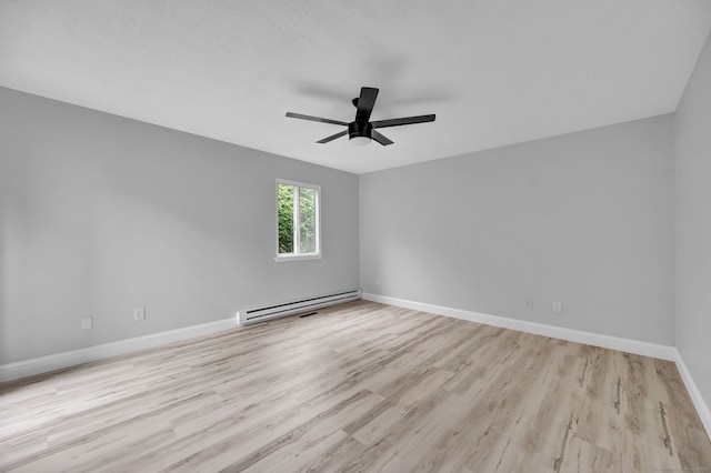 170 Heritage Vlg Unit B, Southbury, CT 06488 - spare room featuring baseboard heating, wood finished floors, ceiling fan, and baseboards