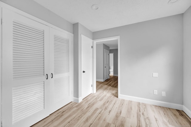 170 Heritage Vlg Unit B, Southbury, CT 06488 - hallway with baseboards and wood finished floors