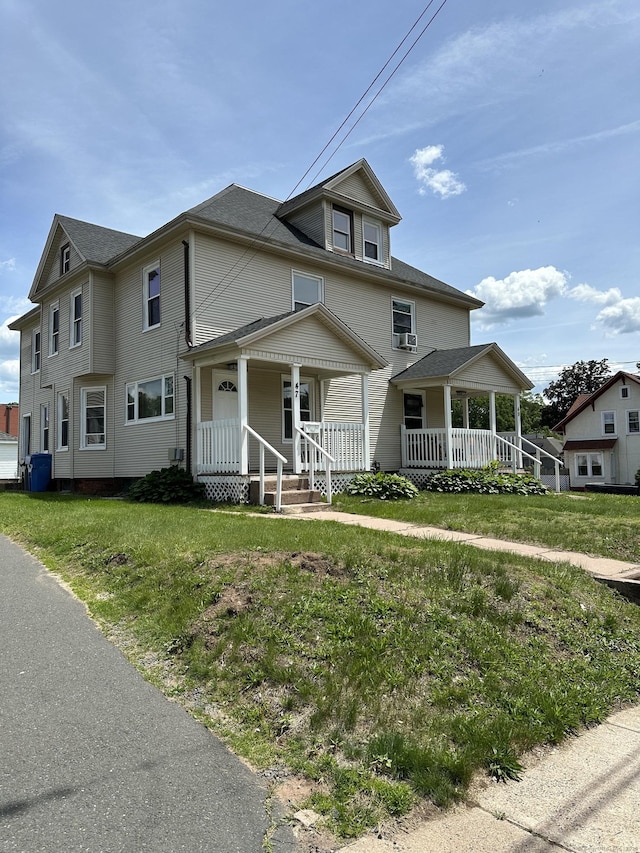 47 Holl St, Manchester, CT 06040 - view of front of home featuring covered porch and a front lawn