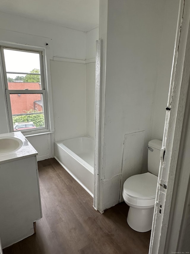 47 Holl St, Manchester, CT 06040 - bathroom featuring wood finished floors, toilet, vanity, and washtub / shower combination