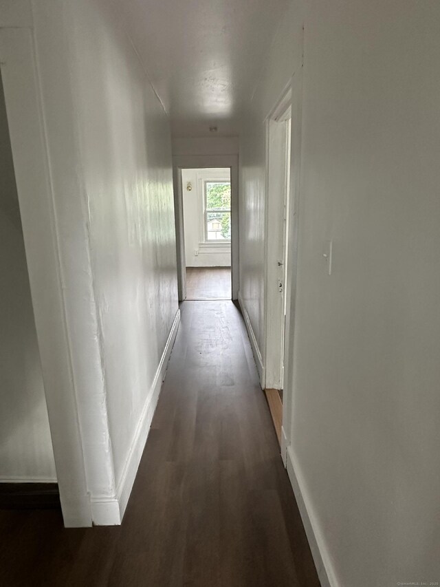 47 Holl St, Manchester, CT 06040 - hall featuring dark wood-style flooring and baseboards