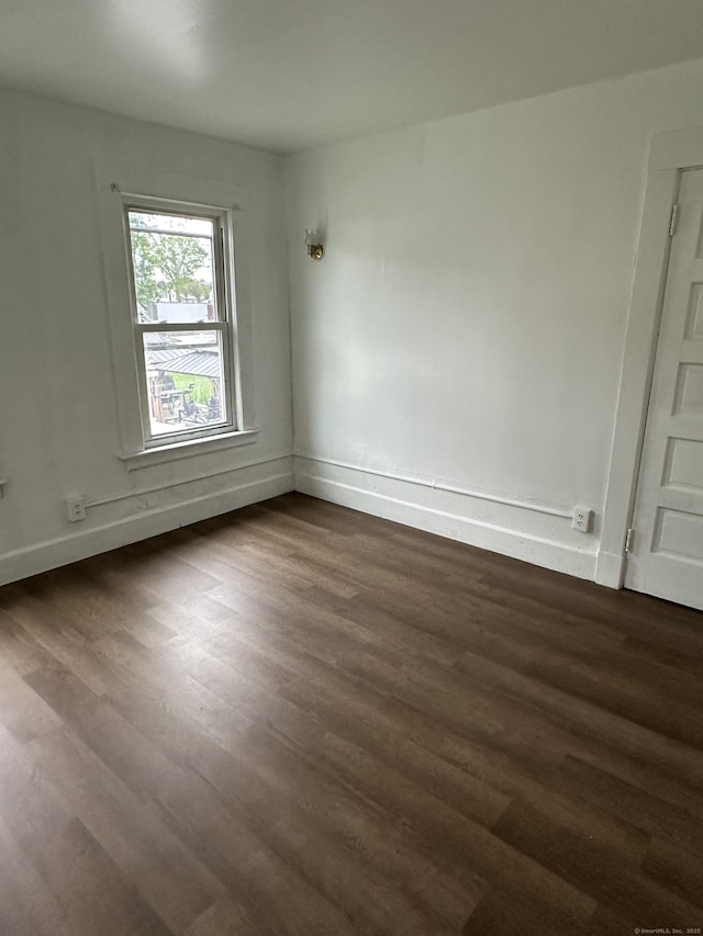 47 Holl St, Manchester, CT 06040 - empty room with dark wood-style floors and baseboards