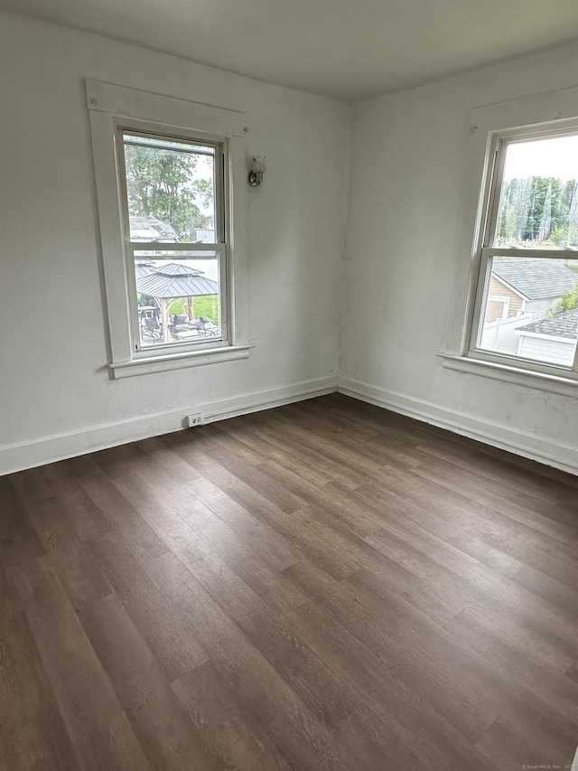 47 Holl St, Manchester, CT 06040 - spare room with dark wood finished floors and baseboards