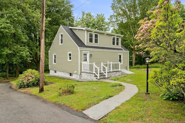 56 Uncas Ave, New London, CT 06320 - view of front of home featuring a front lawn and roof with shingles