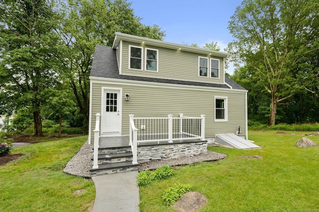 56 Uncas Ave, New London, CT 06320 - rear view of property featuring a lawn and a shingled roof