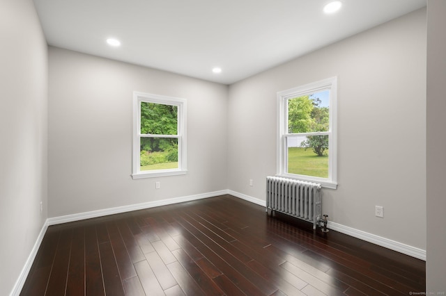 56 Uncas Ave, New London, CT 06320 - spare room featuring radiator heating unit, baseboards, dark wood-type flooring, and recessed lighting