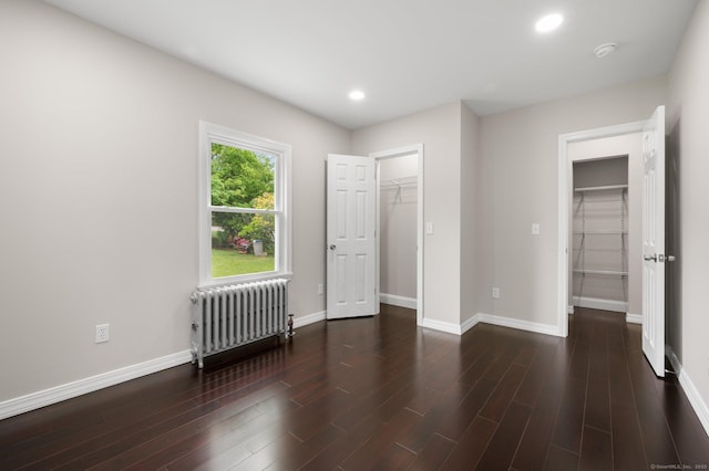 56 Uncas Ave, New London, CT 06320 - bedroom featuring radiator heating unit, a walk in closet, a closet, baseboards, and recessed lighting