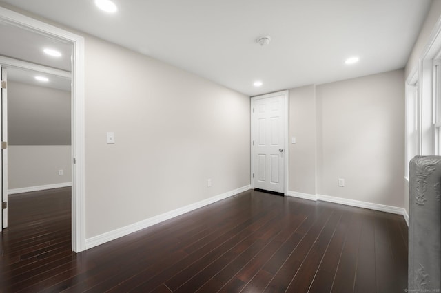 56 Uncas Ave, New London, CT 06320 - spare room featuring baseboards, dark wood-style flooring, a smoke detector, and recessed lighting