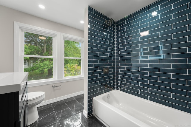 56 Uncas Ave, New London, CT 06320 - bathroom with toilet, healthy amount of natural light, marble tiled flooring, vanity, and recessed lighting