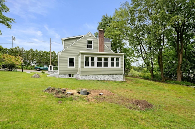 56 Uncas Ave, New London, CT 06320 - back of property featuring a chimney and a yard