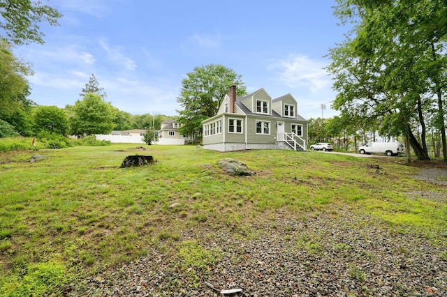 56 Uncas Ave, New London, CT 06320 - view of home's exterior featuring a chimney and a yard