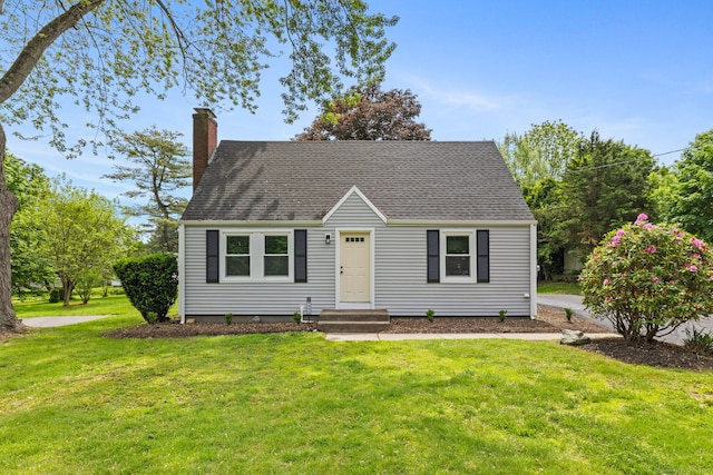 1357 Slater Rd, New Britain, CT 06053 - cape cod house featuring a chimney, a front lawn, and roof with shingles