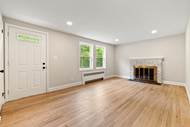 1357 Slater Rd, New Britain, CT 06053 - unfurnished living room featuring radiator, light wood finished floors, baseboards, and recessed lighting