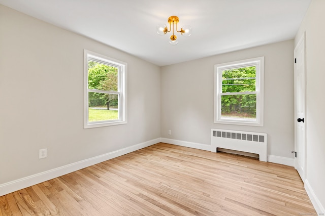 1357 Slater Rd, New Britain, CT 06053 - unfurnished room with radiator, healthy amount of natural light, and baseboards