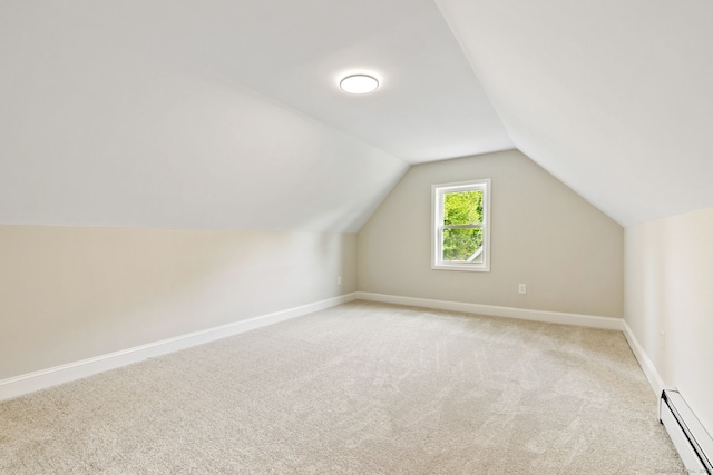 1357 Slater Rd, New Britain, CT 06053 - additional living space with a baseboard heating unit, light carpet, vaulted ceiling, and baseboards