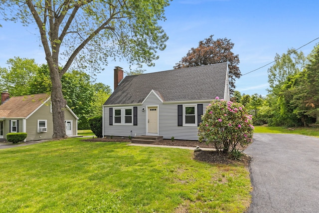 1357 Slater Rd, New Britain, CT 06053 - cape cod home with a chimney, a front lawn, driveway, and a shingled roof