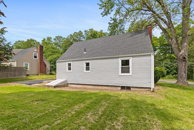 1357 Slater Rd, New Britain, CT 06053 - back of property with a chimney and a shingled roof