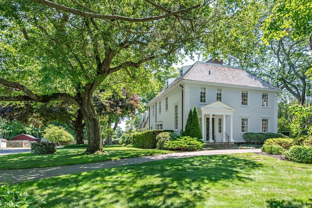 264 Taugwonk Rd, Stonington, CT 06378 - view of front of property featuring a front lawn and a chimney