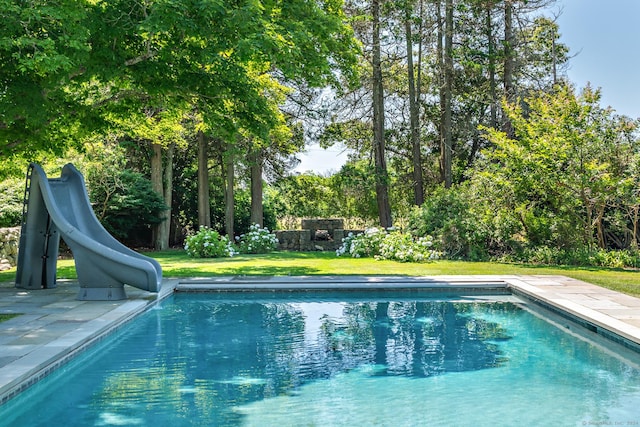 264 Taugwonk Rd, Stonington, CT 06378 - outdoor pool featuring a water slide, a yard, and a patio area