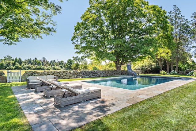 264 Taugwonk Rd, Stonington, CT 06378 - view of pool with a water slide, an outdoor living space, a patio area, and view of wooded area