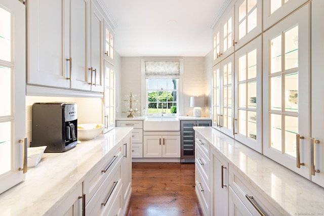 264 Taugwonk Rd, Stonington, CT 06378 - kitchen featuring wine cooler, white cabinetry, dark wood-style floors, glass insert cabinets, and light stone countertops