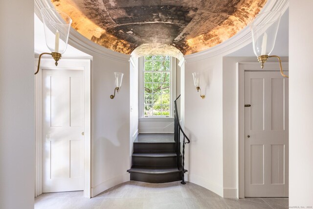 264 Taugwonk Rd, Stonington, CT 06378 - stairway featuring crown molding and tile patterned flooring