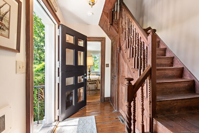 264 Taugwonk Rd, Stonington, CT 06378 - foyer featuring healthy amount of natural light, wood-type flooring, and stairway