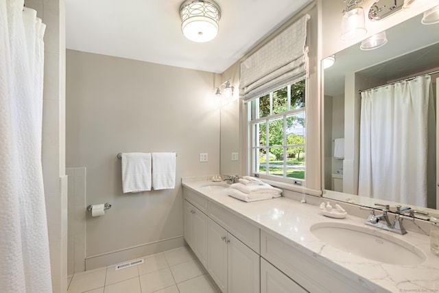 264 Taugwonk Rd, Stonington, CT 06378 - bathroom with tile patterned flooring, double vanity, and a shower with curtain