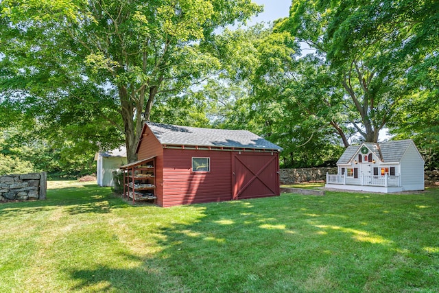 264 Taugwonk Rd, Stonington, CT 06378 - view of green lawn with an outdoor structure and view of scattered trees