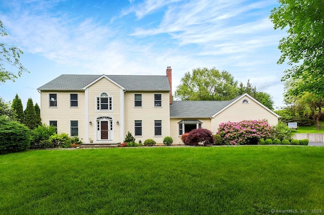 12 Fawn Ridge Dr, Brookfield, CT 06804 - colonial home featuring a chimney, a front yard, and a shingled roof