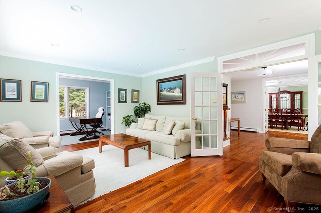 12 Fawn Ridge Dr, Brookfield, CT 06804 - living room with wood finished floors, crown molding, and a baseboard radiator